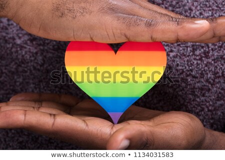 Stock photo: Palms Of Human Hands Thumbs Up Over Rainbow