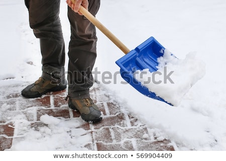 Сток-фото: Man Shoveling And Removing Snow