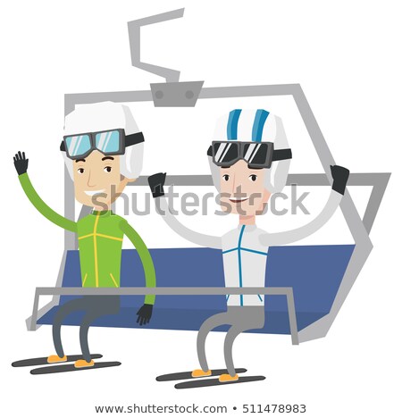 Foto stock: Two Happy Skiers Using Cableway At Ski Resort