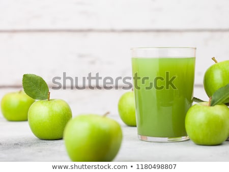 Glass Of Fresh Organic Apple Juice With Granny Smith Green Apples In Box On Wooden Background Foto stock © DenisMArt