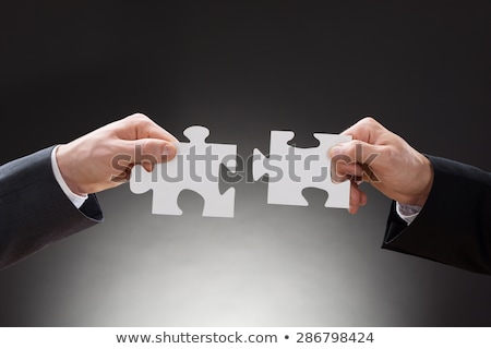 ストックフォト: Two Businesspeoples Hand Holding Jigsaw Puzzle