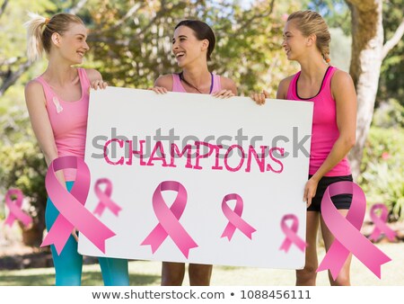 Foto stock: Champions Text And Pink Breast Cancer Awareness Women Holding Card
