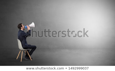 Stock photo: Businessman Staying In An Empty Room With Stuffs On His Lap