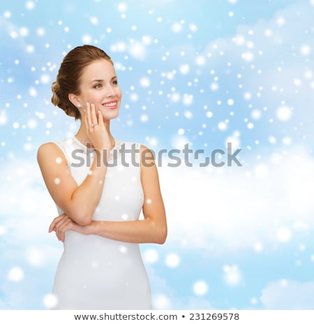 Stock photo: Female Hand With Engagement Ring Touching Fiances Face