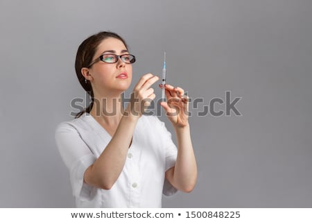 Stockfoto: Woman Hand Holding Syringe