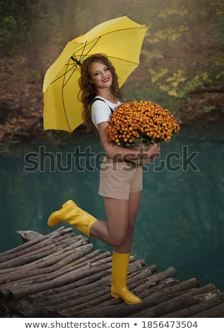 ストックフォト: Girl With Bouquet And Umbrella