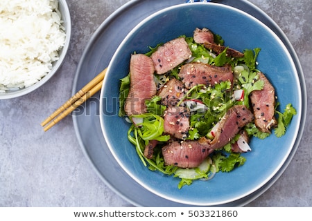 Сток-фото: Tasty Dish Of Roast Beef With Rice And Salad Leaves
