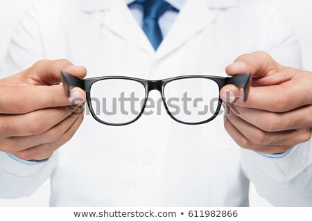 Stockfoto: Close Up Of Optician With Glasses At Optics Store