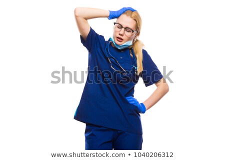 Stok fotoğraf: Woman Doctor In Blue Scrubs Touch Her Head
