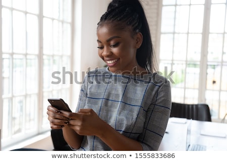 ストックフォト: Young Businesswoman With Agenda Standing In Modern Office