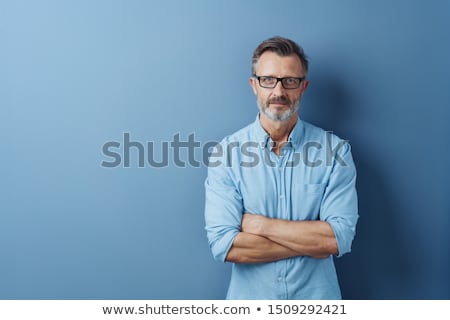 Foto stock: Serious Senior Man Staring Intently At The Camera