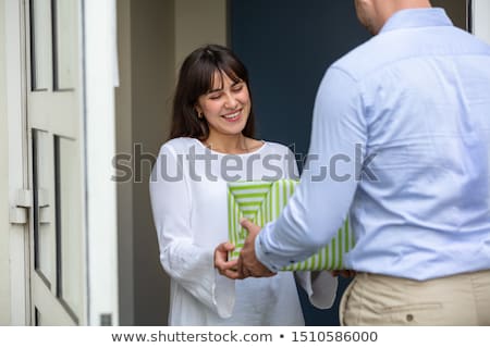 Stockfoto: Man Giving Gift Box To His Neighbor