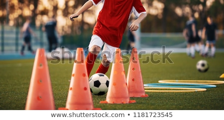 Foto stock: Children Training Soccer On Field Young Kids Boys