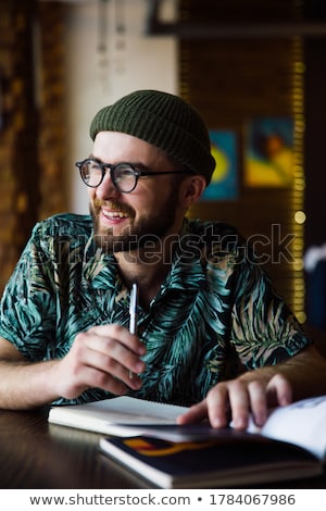 Foto d'archivio: Businessman Sitting Indoors And Writing Plan In His Diary