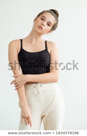 Foto stock: Woman In Sleeveless Top Posing In Style