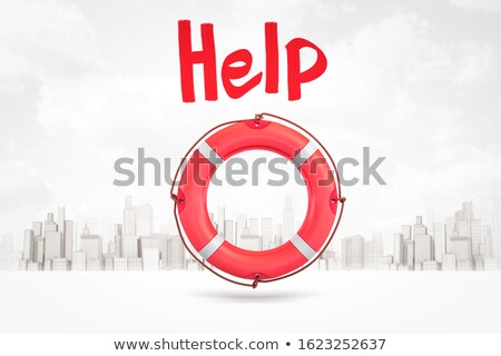 Foto stock: Red And White Rescue Ring Against Skyscrapers