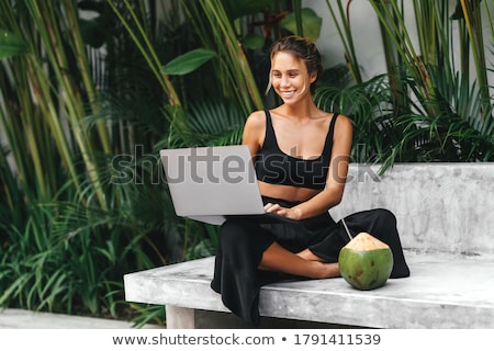 Stock photo: Happy Woman In Bikini Sitting At Swimming Pool