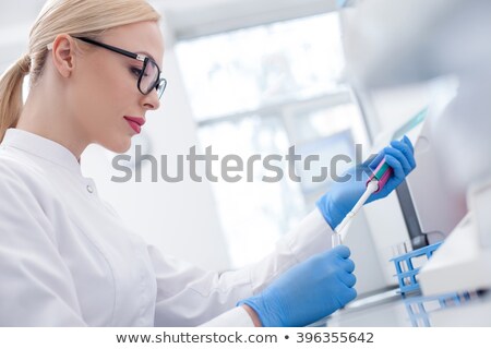 Foto stock: Female Doctor Preparing Test Tube For Biological Specimen