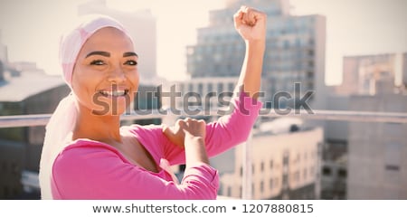 ストックフォト: Smiling Woman Wearing Mantra Scarf With Breast Cancer Awareness