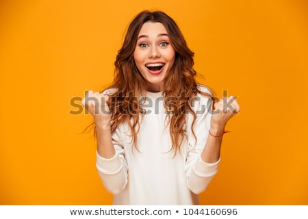 Stock photo: Portrait Of Charming Woman 20s With Long Hair Surprising And Hol