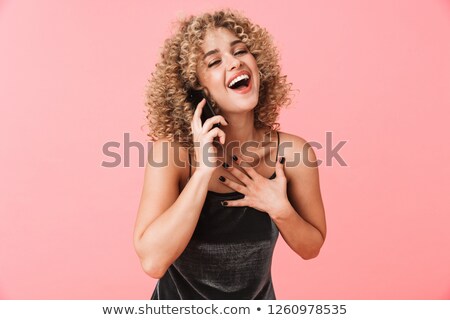 ストックフォト: Portrait Of Glamorous Curly Woman 20s Smiling And Talking On Mob