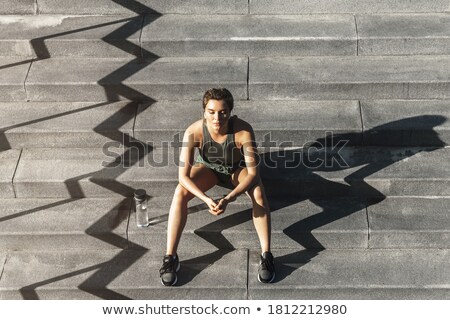 Stock fotó: Serious Young Sports Woman Sitting Outdoors