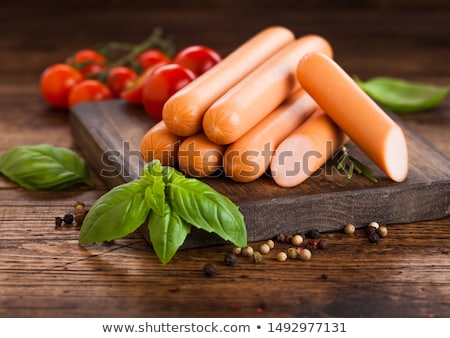 Stok fotoğraf: Classic Boiled Meat Pork Sausages With Pepper And Basil And Cherry Tomatoes On White Background Mac