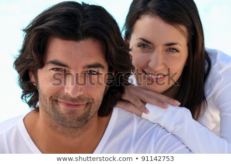 [[stock_photo]]: Head And Shoulders Shot Of A Well Matched Couple In White