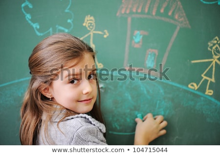 Stock fotó: Little Girl Drawing On Board