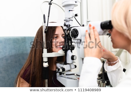 Foto d'archivio: Young Man At Optician With Glasses