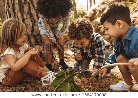 Stock photo: Children With A Magnifying Glass
