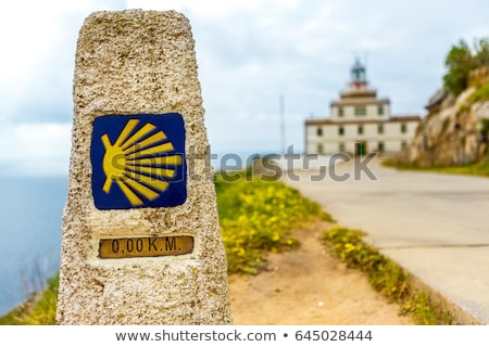Stok fotoğraf: Saint James Way Sign And Lighthouse Of Finisterre
