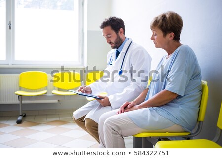 Foto stock: Worried Senior Adult Woman Waiting In Doctor Office