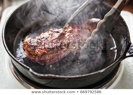 Stok fotoğraf: Beef Steak In The Frying Pan