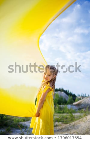 Foto stock: Girl In Yellow Dress