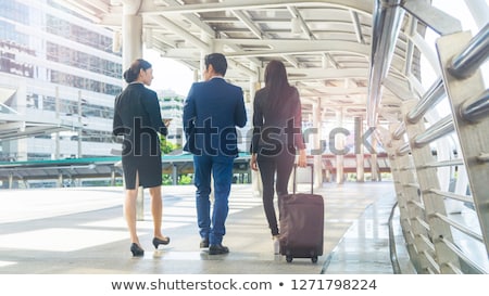 Foto stock: Cheerful Smart Business Lady Walking With Files