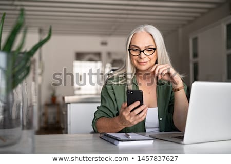 Stok fotoğraf: Senior Woman Using Mobile Phone