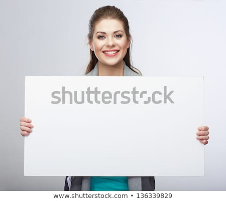 Foto stock: Smiling Businesswoman Showing White Blank Card