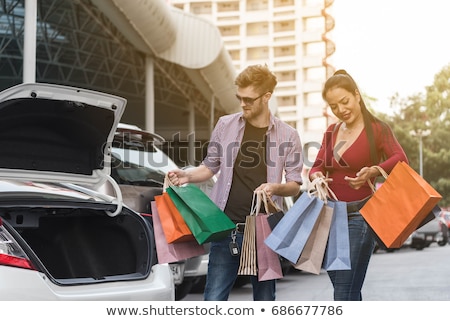 [[stock_photo]]: Mature Couple Putting Bags Into Car