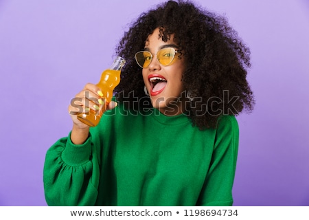 Stock fotó: Amazing Pretty African Woman Isolated Over Violet Background Showing Okay Gesture Drinking Soda