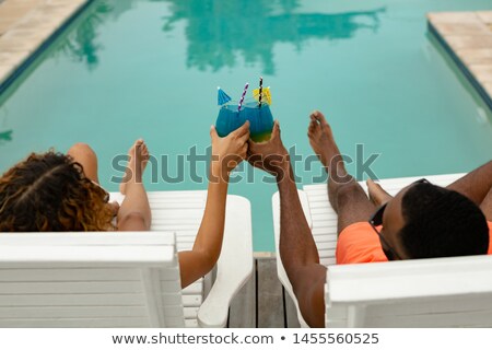 Сток-фото: Sun Loungers Near Swimming Pool