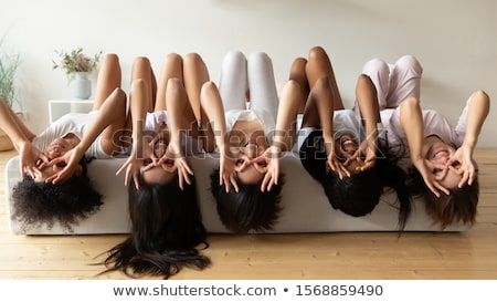 Stock foto: Beautiful Multi Ethnic Girls Relax Together And Lying On Bed Inside The Camper Van
