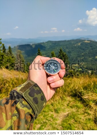 Zdjęcia stock: Mans Hand Holding Clear Compass Isolated On White Background