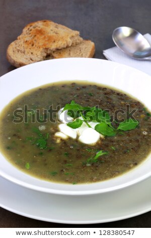 Foto stock: Green Lentil Soup With Watercress Sour Cream And Toast