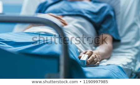 Foto d'archivio: Young Patient Lying On A Hospital Bed