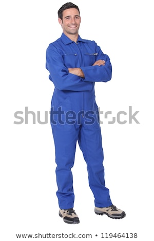 Foto d'archivio: Man In Blue Overall With Wrench