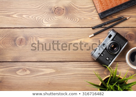 Stockfoto: Office Desk Table With Camera Supplies And Coffee