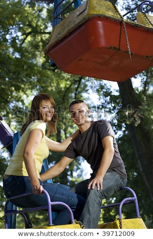 Stock photo: Adult Man And Woman On A Carousel