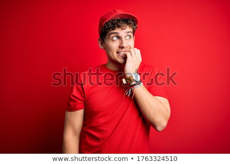 ストックフォト: Man In A Red Cap Stands On Hands
