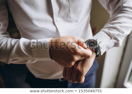 Foto stock: Married Man In Blue Suit Adjusting His Sleeve